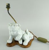 CHINESE CHENIN BLANC DOG OF FO TABLE LAMP in seated position with front paw raised, mounted to a