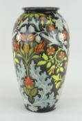 MOORCROFT BALUSTER VASE of brown grey ground profusely decorated with stems of flowers and