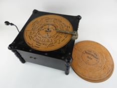 TURN OF THE CENTURY ARISTON ORGANETTE in an ebonized case with incised decoration and inscription '