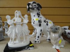 THREE CERAMIC ORNAMENTS comprising seated dalmation puppy, a mounted Parian group of three maidens