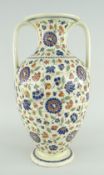 FRENCH EARTHENWARE AMPHORA SHAPED VASE, possibly Longy Pottery, decorated with flowers in the