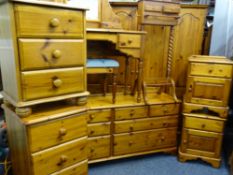 EXTENSIVE ANTIQUE PINE EFFECT SUITE OF BEDROOM FURNITURE to include four door wardrobe, long chest