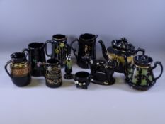 BLACK LUSTRE, a parcel of 9 teaware and other pieces and a black Jackfield oval based cow creamer