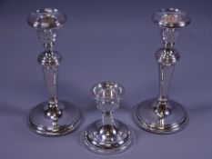 SILVER CANDLEHOLDERS, a pair on circular bases with tapered plain columns, Birmingham 1984/9 (