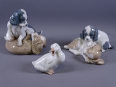 NAO - two china groups of dogs at play and another of a duck