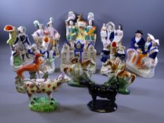 STAFFORDSHIRE FLATBACKS, a quantity and two pottery cow creamers