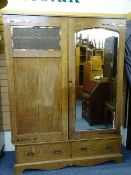 ARTS & CRAFTS STYLE TWO DOOR OAK WARDROBE, mirrored to one door with copper type strap hinges and