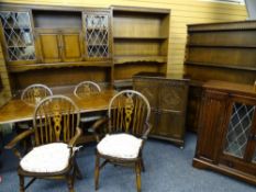 EXTENSIVE PRIORY & GILD OAK DINING ROOM/SITTING ROOM SUITE of dresser, unit and cabinets with a