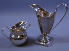 TWO SILVER CREAM JUGS, one square based, helmet shaped, 3 ozs, London 1809 and a small bowl shaped