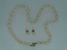 SHORT PEARL NECKLACE with eighteen carat gold clasp and pair of gold mounted earrings, 36grms in a