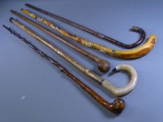 WALKING STICKS, three Old Country made sticks, one with silver band and tip, a modern Shepherd's