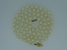 LONG PEARL NECKLACE with nine carat gold clasp, 36grms in a Boodle & Dunthorne box