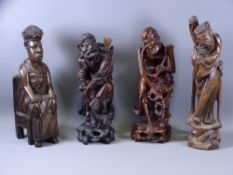 FOUR EASTERN & AFRICAN CARVED WOODEN FIGURINES to include an African noble woman seated on a