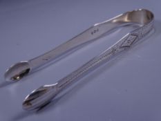 GEORGIAN SILVER SUGAR NIPS with dotted and floral decoration, 1.1 oz, London 1799