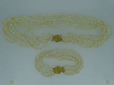 TWO FRESHWATER PEARL FOUR STRAND NECKLACES, 49grms and 21grms, in a Boodle & Dunthorne box