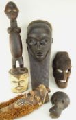 FIVE VARIOUS AFRICAN MASKS including Pende, Tanzanian four faced mask, Dan Simian mask (damaged),