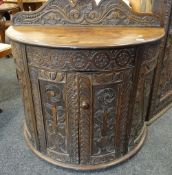 19TH CENTURY MAHOGANY CARVED DEMI-LUNE CUPBOARD with raised back, 94cms wide