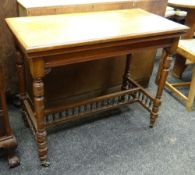 LATE VICTORIAN MAHOGANY FOLDOVER CARD TABLE, square top on turned legs, with baluster spindle