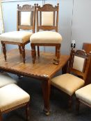 EDWARDIAN ARTS & CRAFTS-STYLE MAHOGANY EXTENDING DINING TABLE (with two extra leaves) and set of six
