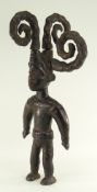 EKOI STANDING MALE FIGURE with four socketed coiled braids, 61cms high Condition Report: one braid