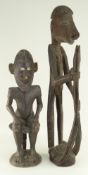 IATMUL SEATED ANCESTOR FIGURE, 50cms and standing Asmat figure, 67cms (2)