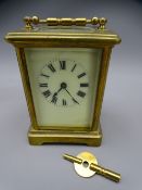 FRENCH BRASS CASED CARRIAGE CLOCK with key, 14cms H handle up