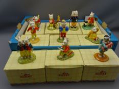 TEN RUPERT THE BEAR COLLECTABLE FIGURINES by Royal Doulton, boxed