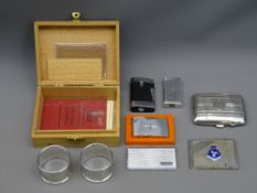 PAIR OF SILVER NAPKIN RINGS, 1 troy oz, Birmingham 1941, a lady's cigarette case, 2.2 troy ozs,