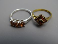 TWO NINE CARAT GOLD RINGS, one triform pink sapphires in white gold setting and band, plus one