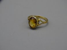 NINE CARAT GOLD RING with split shoulder setting of large citrine stone, 3.2grms