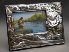LARGE SILVER PHOTO FRAME showing 'Fisherman', embossed to front and velvet easel back, 1995
