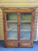 PITCH PINE VINTAGE BOOKCASE TOP having twin glazed doors over two lower drawers with panel sides,