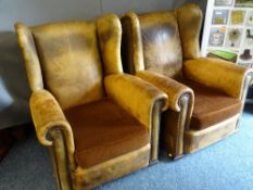 VINTAGE LEATHER WINGBACK ARMCHAIRS, a pair, with foldover arms and studded detail, 88cms H, 85cms W,