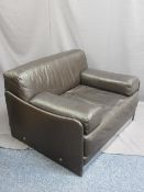 MODERN BROWN LEATHER EFFECT OVERSIZED EASY ARMCHAIR with chrome detail, 72cms H, 106cms W, 62cms D