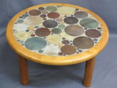 STYLISH MID CENTURY CIRCULAR COFFEE TABLE set with circular pottery discs of various sizes, framed
