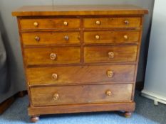 VICTORIAN MAHOGANY CHEST of six short over two long drawers with turned wooden knobs on a platform