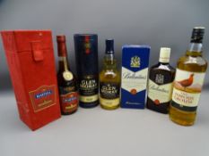 THREE UNOPENED BOTTLES OF WHISKY and a bottle of Martell Fine Cognac in a presentation case