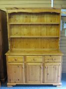 MODERN PINE DRESSER with two shelf rack over a base arrangement of three drawers and three