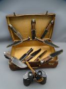 VINTAGE SUITCASE & CONTENTS to include ten modern Bowie knives and a pair of 7x50 Excelsoir
