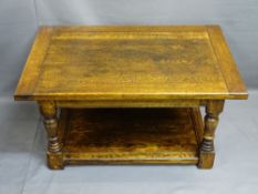 ANTIQUE OAK STYLE COFFEE TABLE with cleated end rectangular top on turned and block supports with