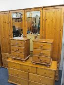 MODERN PINE BEDROOM SUITE of four door wardrobe, 198cms H, 200cms W, 58cms D with twelve drawer base