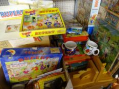 MIXED QUANTITY OF RUPERT THE BEAR COLLECTABLES to include jigsaws, games, crockery and diecast