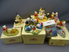 SIX RUPERT THE BEAR COLLECTABLE FIGURINES by Royal Doulton along with a Wedgwood pottery moneybox