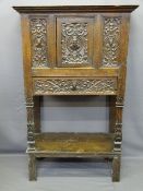CONTINENTAL CARVED OAK & PINE HUTCH CUPBOARD, linenfold detail to the sides with figural and head