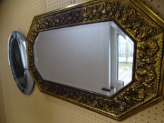 OBLONG BRASS FRAMED BEVELLED WALL MIRROR and a circular frameless art glass mirror