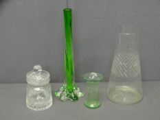 FOUR PIECES OF GLASSWARE, a vase, lidded pot, small green vase and a green twist effect rose vase