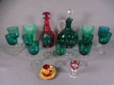 DECORATIVE GLASSWARE - a good dark green glass decanter with plain handle and stopper together