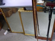 TWO GILT FRAMED WALL MIRRORS, a wood framed wall mirror and two walking sticks