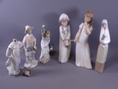 NAO GROUP OF GIRL FIGURINES along with a Lladro boy with fishing basket (some damages)