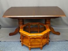 TWIN PEDESTAL MAHOGANY EFFECT DINING TABLE and a glass topped coffee table, 75.5cms H, 152cms L,